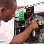 IT Support Technician Man Fixing Desktop Computer 150x150